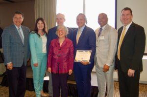 Honoree Mary Chin, of AACA joins others for a photo.